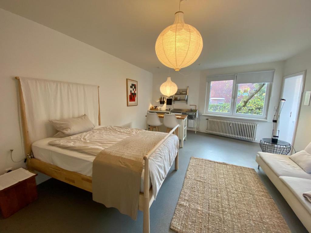 Postel nebo postele na pokoji v ubytování Kläve12 Guesthouse