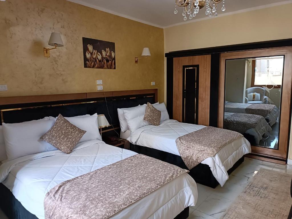 Postel nebo postele na pokoji v ubytování Indiana Hotel