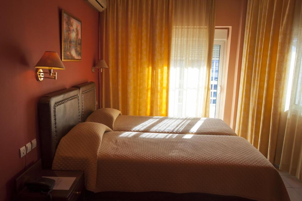 Postel nebo postele na pokoji v ubytování Hotel Marianna