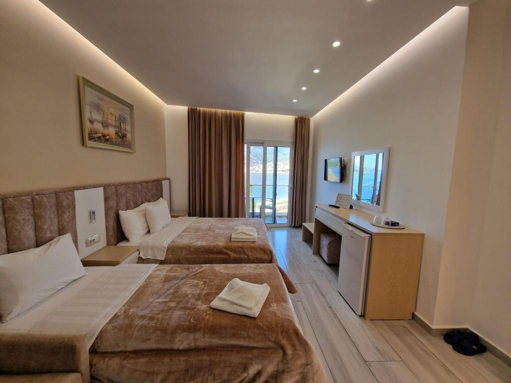 Postel nebo postele na pokoji v ubytování Seaside Hotel