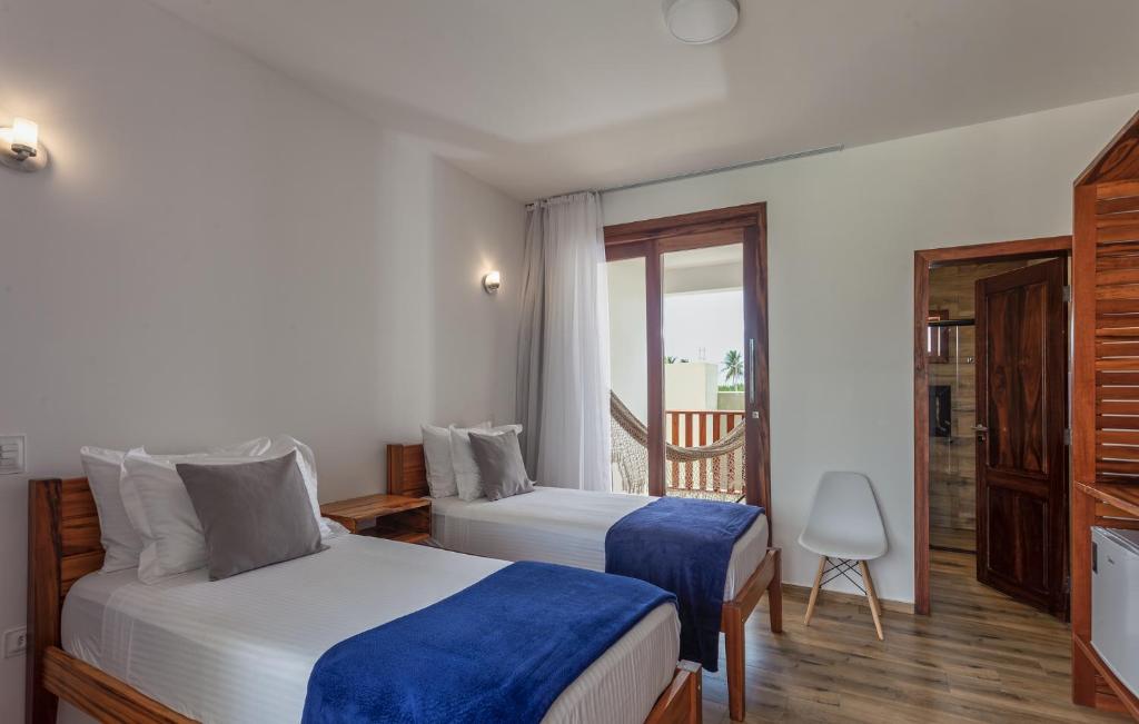 Postel nebo postele na pokoji v ubytování Aiolos Hotel & Discoveries