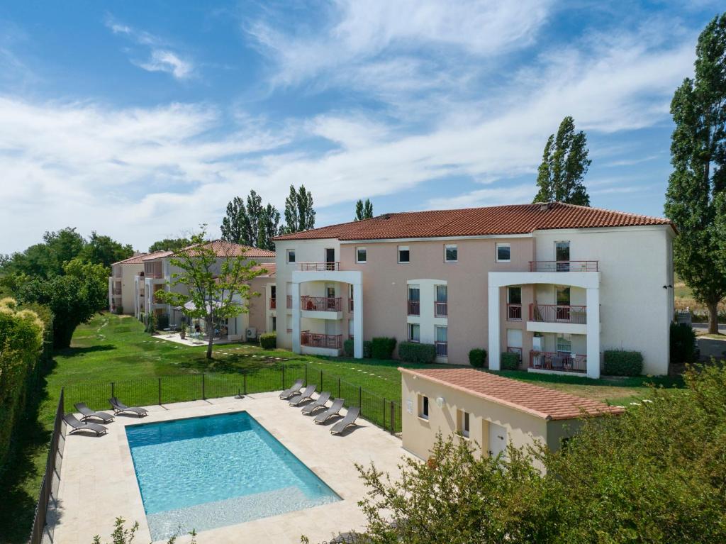 a large house with a swimming pool in front of it at Garden & City Aix En Provence - Puyricard in Aix-en-Provence