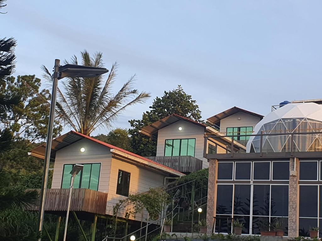 a group of houses with a glass dome at THE CLOUD KINABALU- Chalet in Ranau