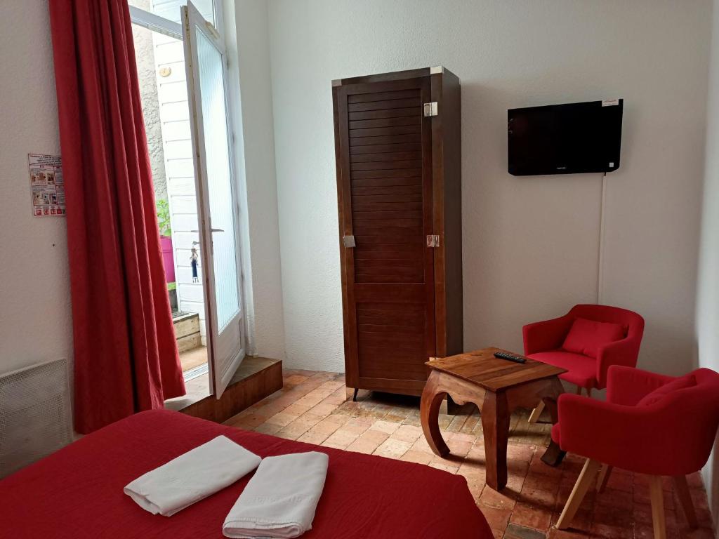 Postel nebo postele na pokoji v ubytování Hotel Saint Amant