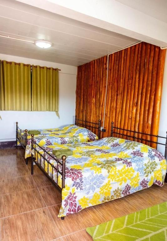 Postel nebo postele na pokoji v ubytování One khaokho homestay