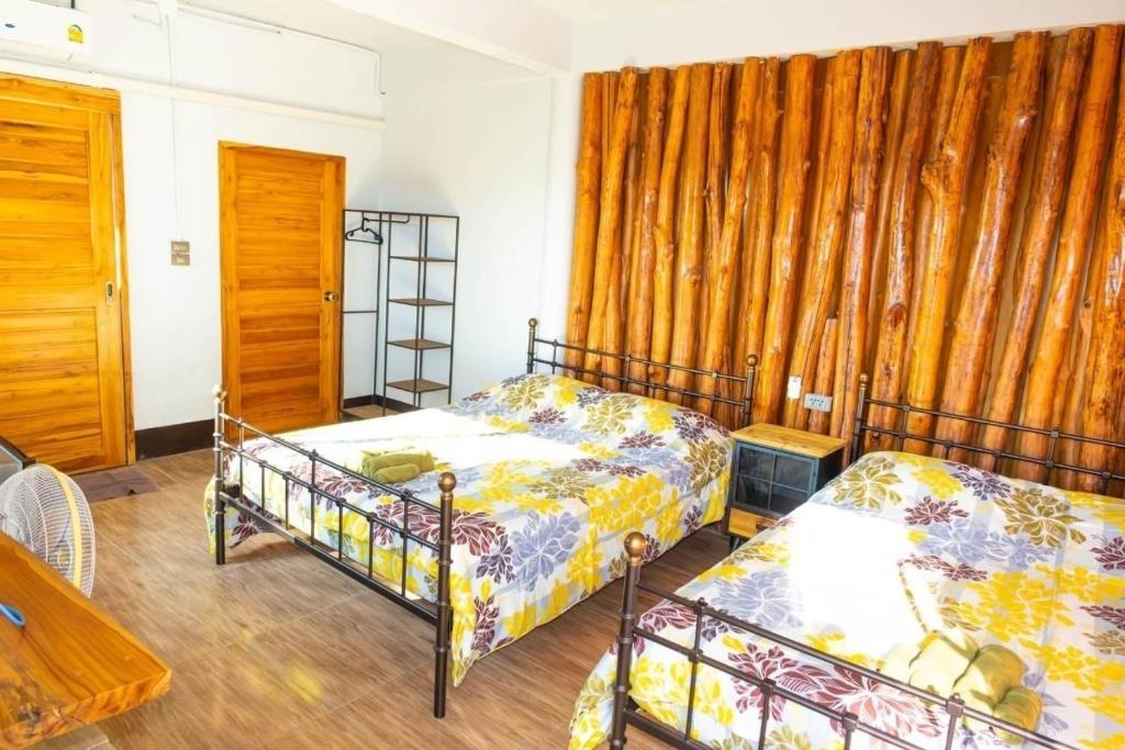 Postel nebo postele na pokoji v ubytování One khaokho homestay
