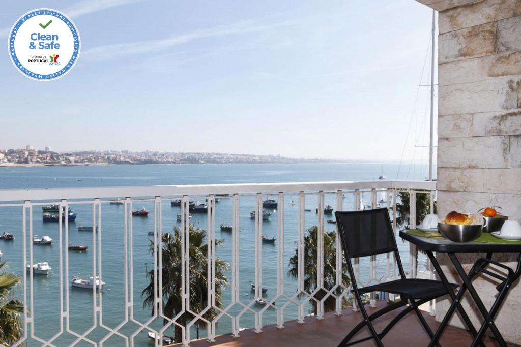 a balcony with a view of the water and boats at Remarkable view over Cascais Bay in Cascais
