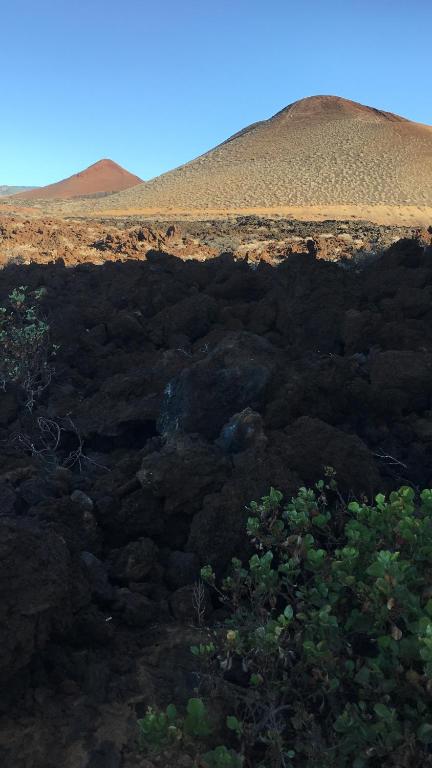 a view of a desert with a hill in the background at Apto Tagoro, La Restinga in La Restinga