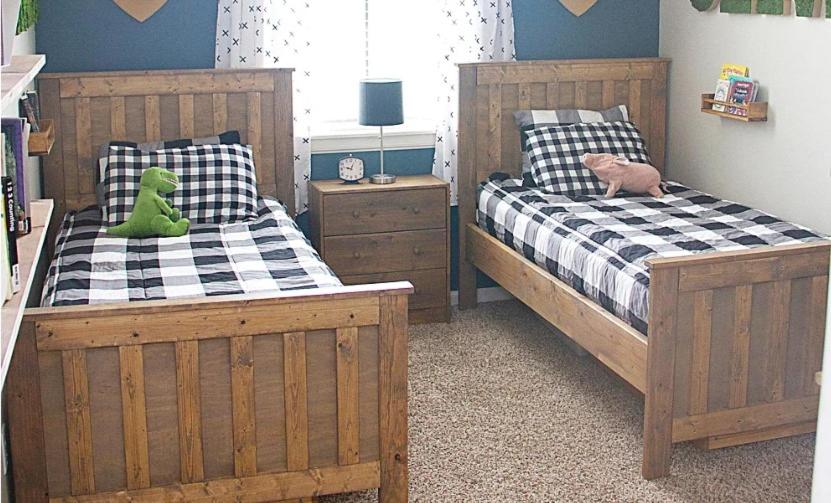 a bedroom with two beds and a teddy bear on the bed at stay at seas in Calangute