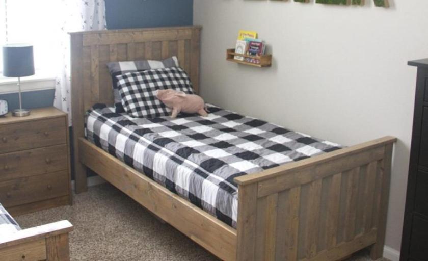 a bed with a cat sitting on top of it at stay at seas in Calangute