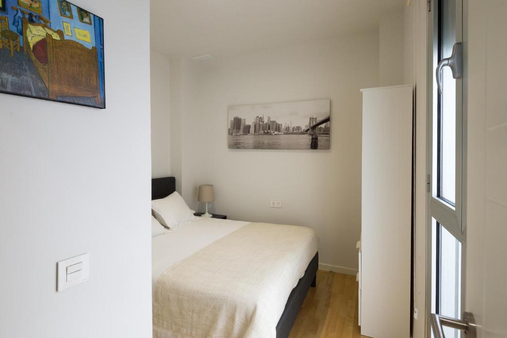 Łóżko lub łóżka w pokoju w obiekcie Veoapartment Rastro