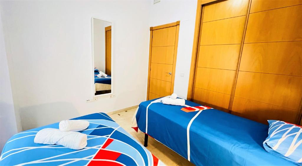 Postel nebo postele na pokoji v ubytování ARENAL GOLF HOME