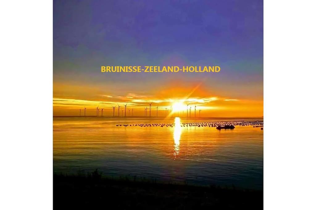 a sunset over the water with the words burnswick island island holland at Bruinisse-Zeeland-Holland in Bruinisse