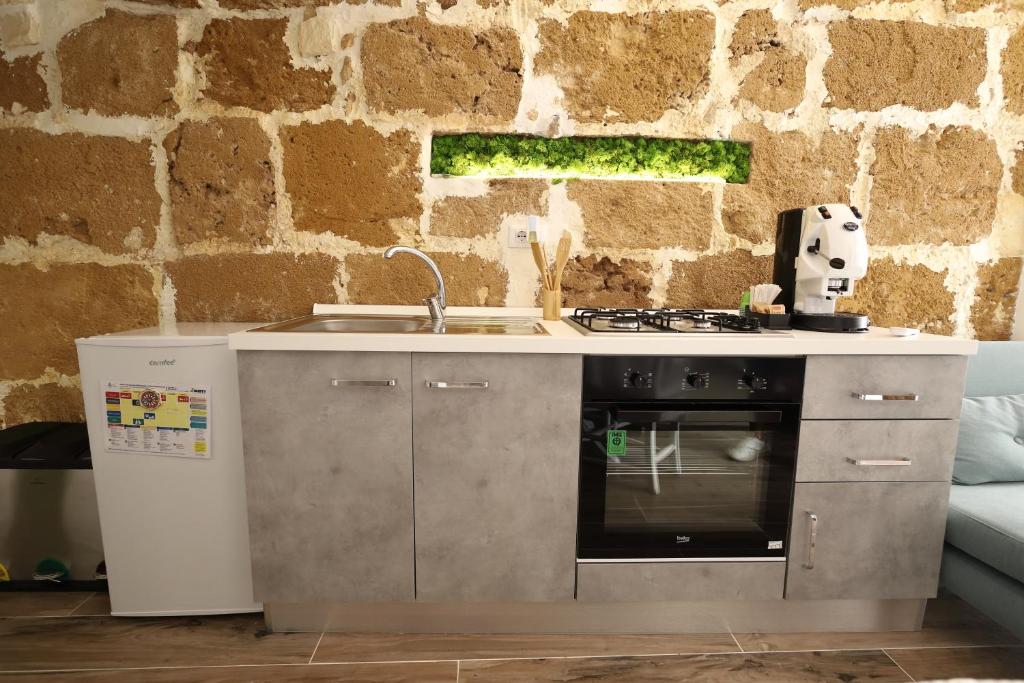 Kuchyň nebo kuchyňský kout v ubytování La Maison
