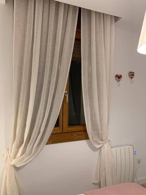 Postel nebo postele na pokoji v ubytování La Casa de la Colonia
