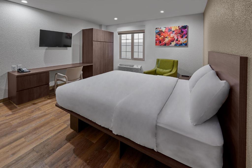 Postel nebo postele na pokoji v ubytování Extended Suites Cancun Cumbres
