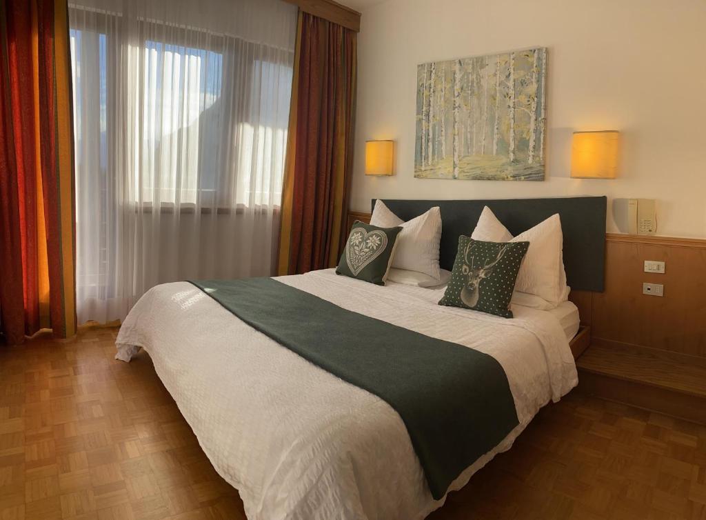 Postel nebo postele na pokoji v ubytování Hotel Arcobaleno