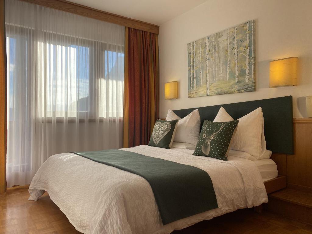 Postel nebo postele na pokoji v ubytování Hotel Arcobaleno