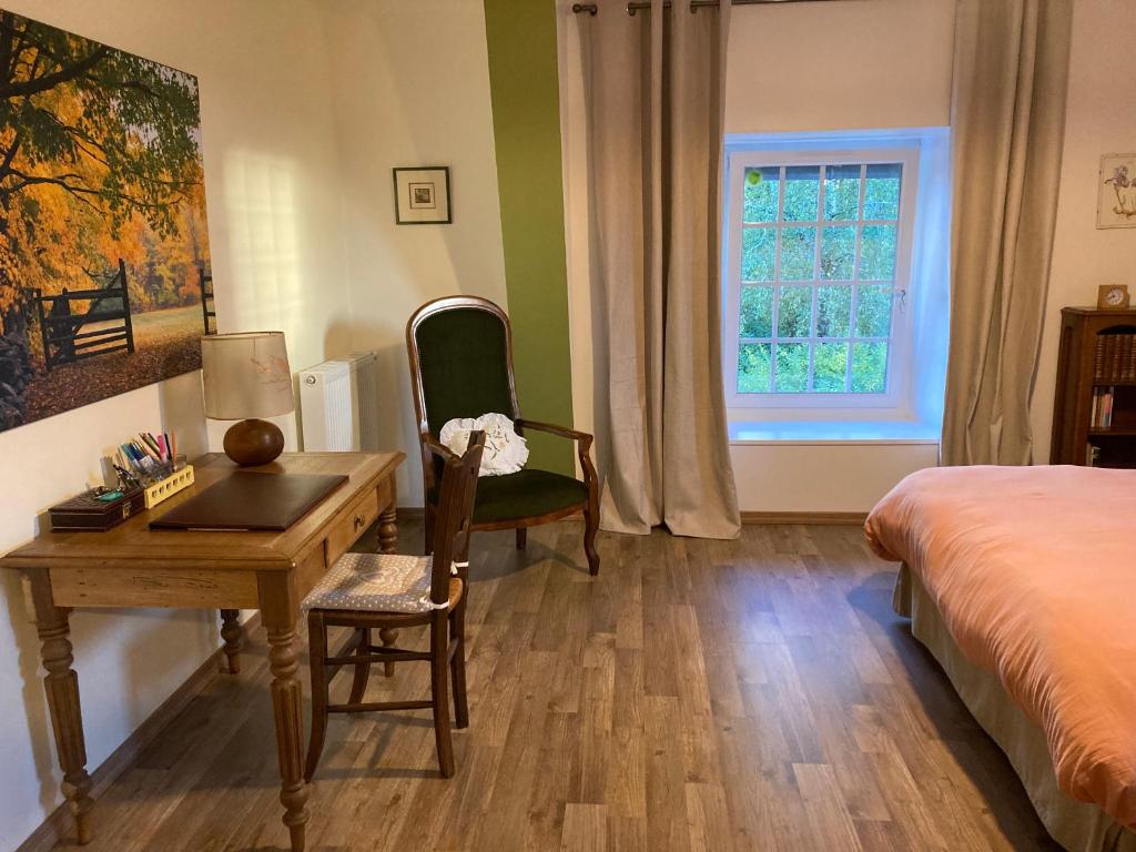 Postel nebo postele na pokoji v ubytování « Le petit verger »