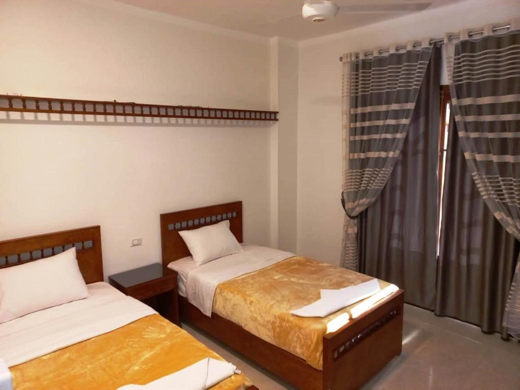 Postel nebo postele na pokoji v ubytování Mikhaila Guest House