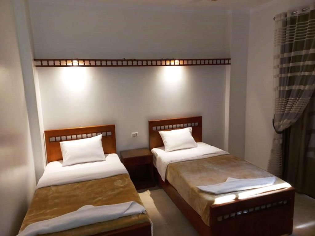 Postel nebo postele na pokoji v ubytování Mikhaila Guest House
