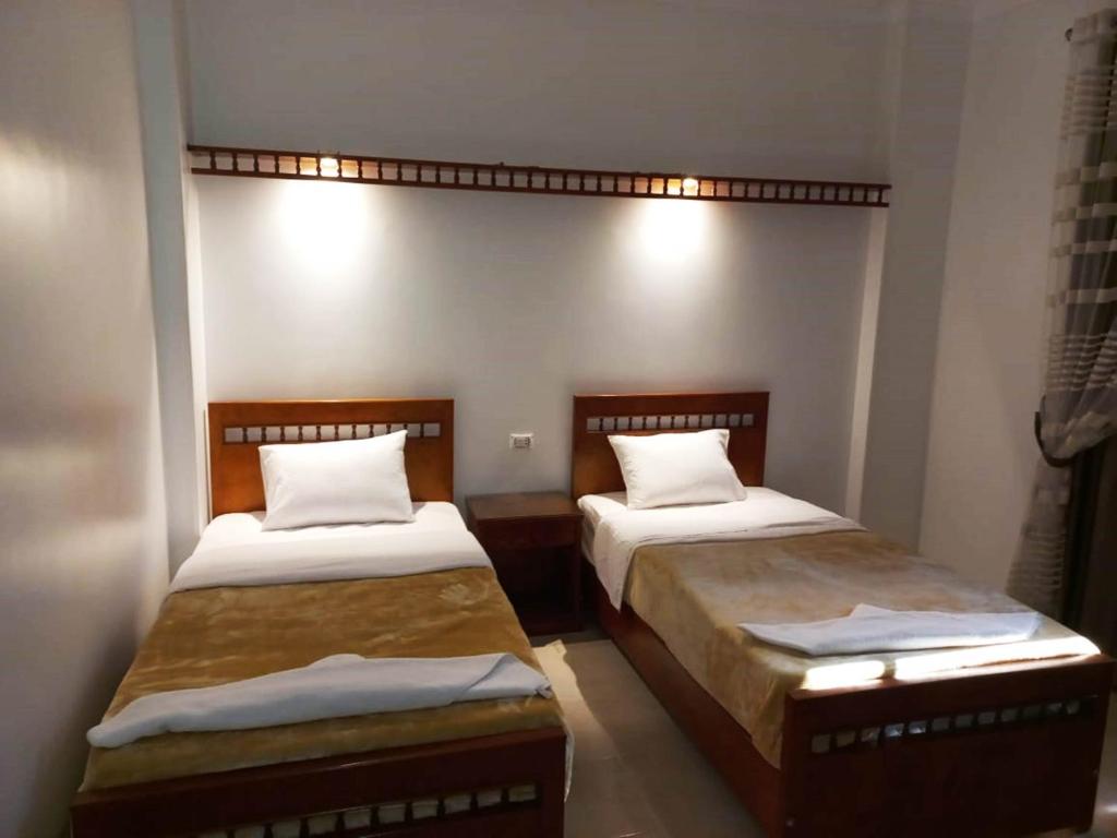 Postel nebo postele na pokoji v ubytování Mikhaila Guest House