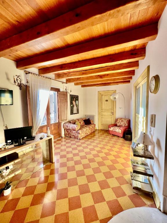 A television and/or entertainment centre at Atenea Luxury Suites - Atenea Collection
