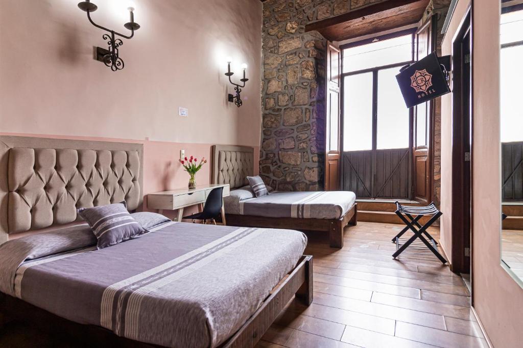 Postel nebo postele na pokoji v ubytování Hotel Cantera Rosa
