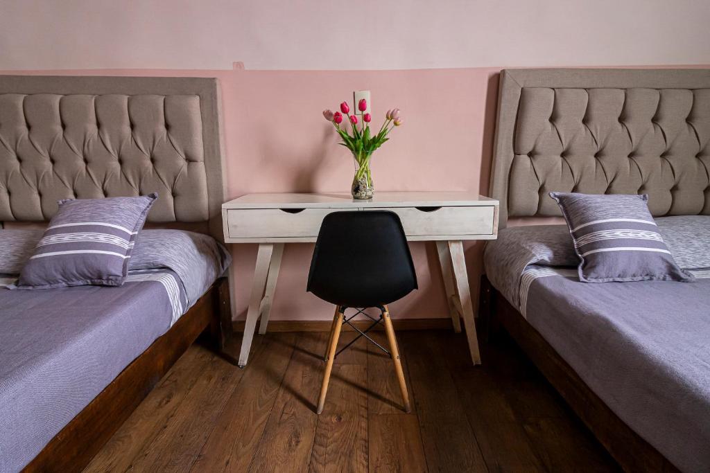 Postel nebo postele na pokoji v ubytování Hotel Cantera Rosa