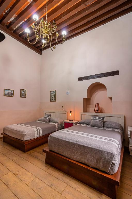 Postel nebo postele na pokoji v ubytování Hotel Cantera Rosa