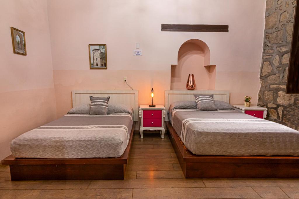 Postel nebo postele na pokoji v ubytování Hotel Cantera Rosa