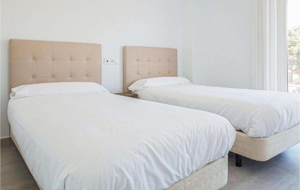 A bed or beds in a room at Gorgeous Apartment In Chipiona