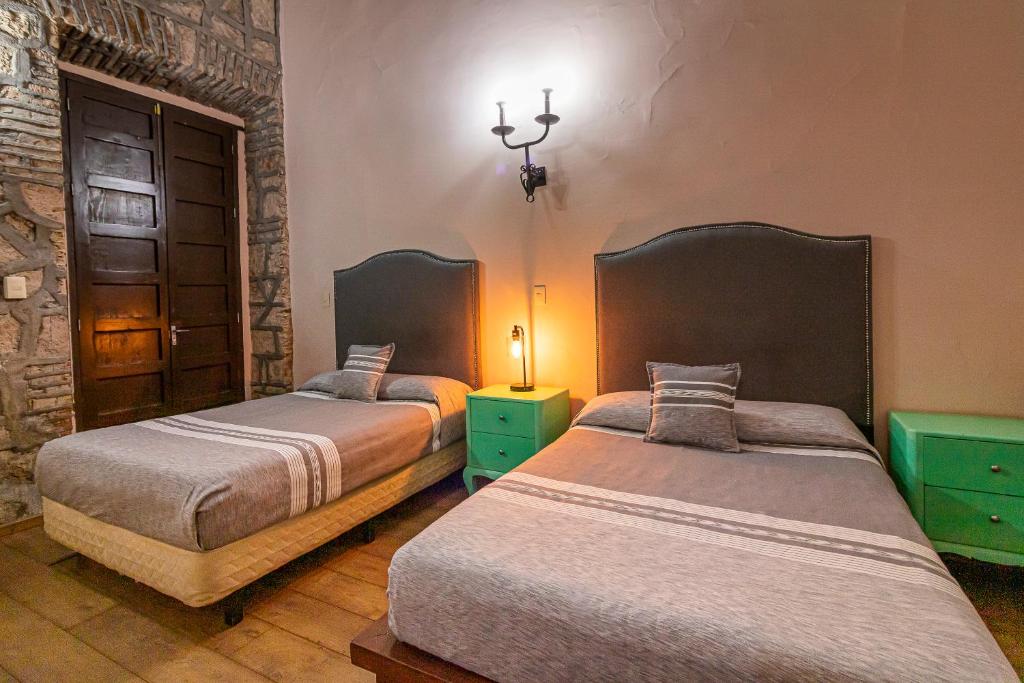 Postel nebo postele na pokoji v ubytování Hotel Cantera Rosa