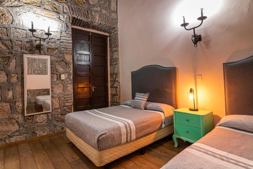 Postel nebo postele na pokoji v ubytování Hotel Cantera Rosa