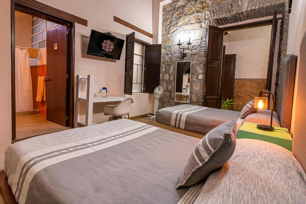 Postel nebo postele na pokoji v ubytování Hotel Cantera Rosa