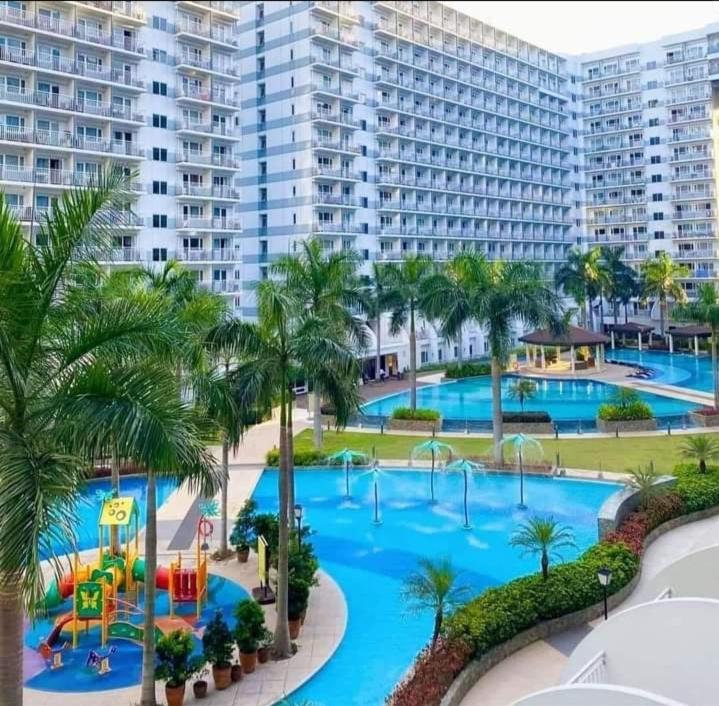 a view of a pool at a resort at Yhanz Z Sea Residences in Manila