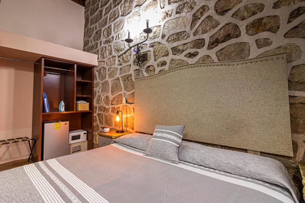 Postel nebo postele na pokoji v ubytování Hotel Cantera Rosa