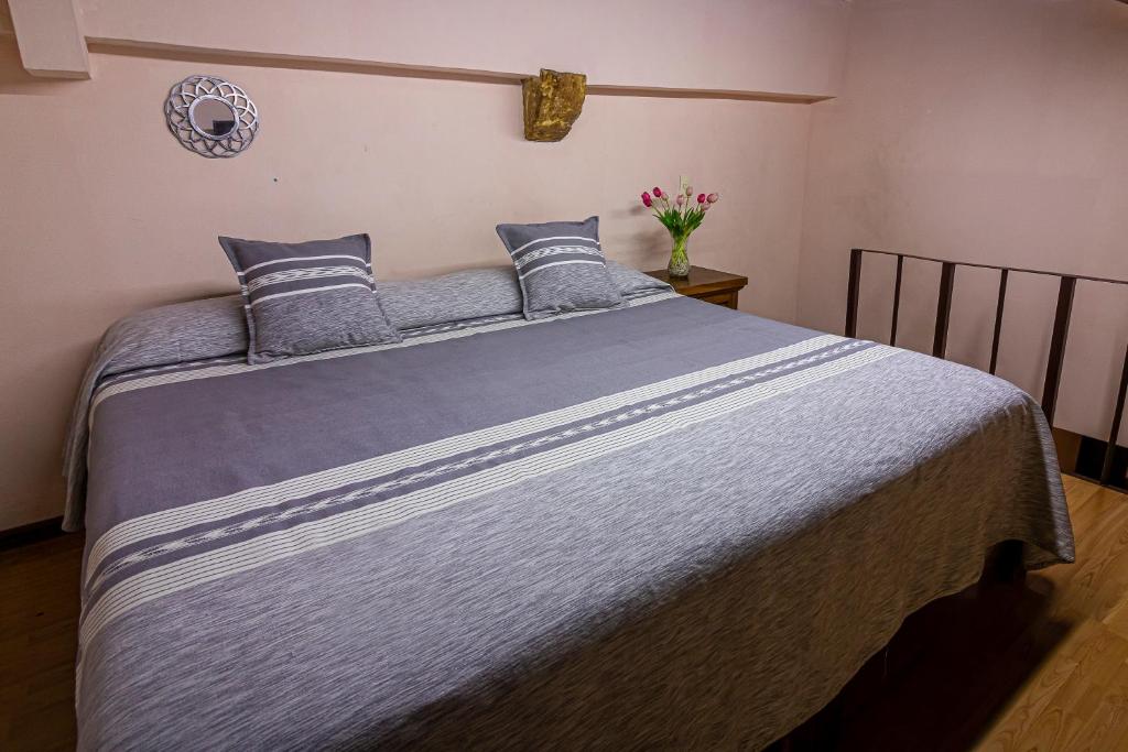 Postel nebo postele na pokoji v ubytování Hotel Cantera Rosa