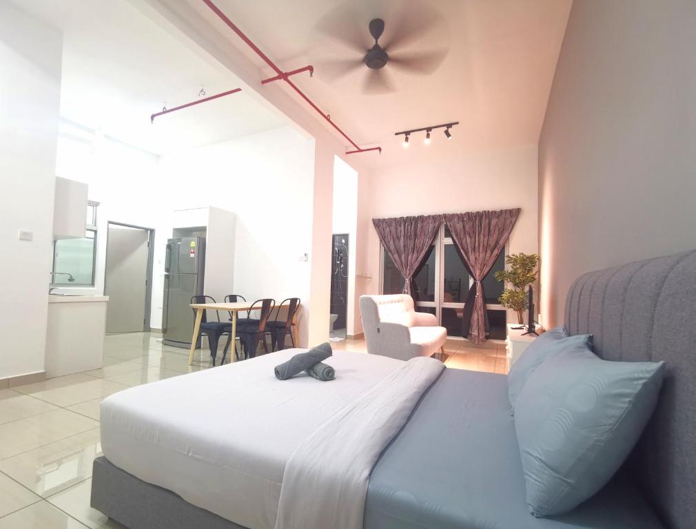 a bedroom with a bed with a stuffed animal on it at Austin Manhattan 1BR Johor Bahru by Maco Home in Johor Bahru