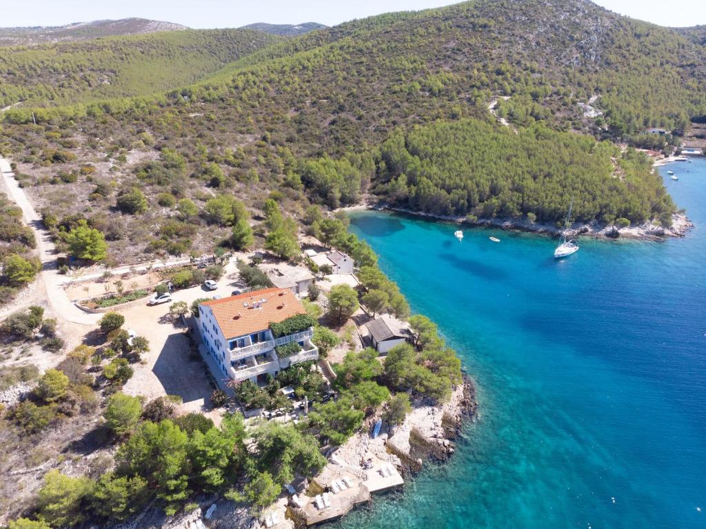 an aerial view of a house on a island in the water at Apartments Perfect place in Hvar