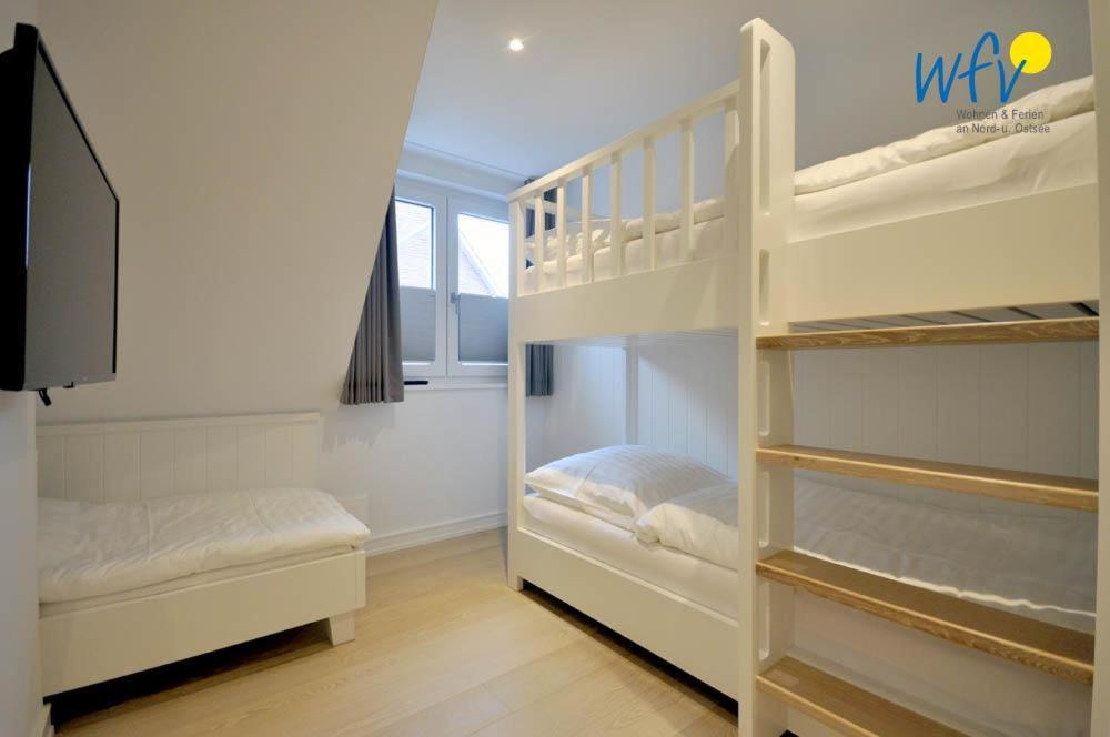 Postel nebo postele na pokoji v ubytování Achterhus - Ferienwohnung Inseltraum