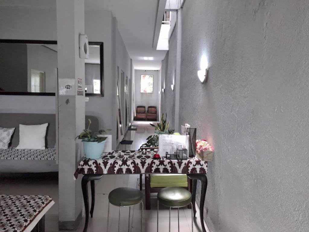 Postel nebo postele na pokoji v ubytování UNIK Guest House Syariah