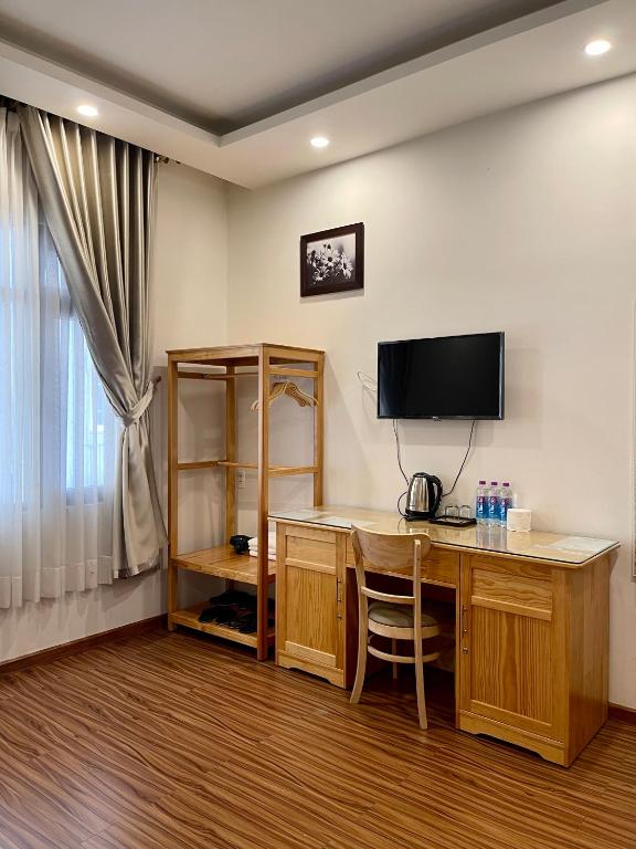 Postel nebo postele na pokoji v ubytování Tuan Long Da Lat Hostel