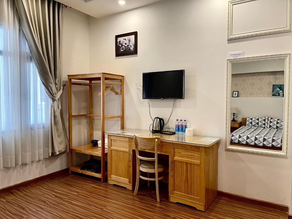 TV a/nebo společenská místnost v ubytování Tuan Long Da Lat Hostel