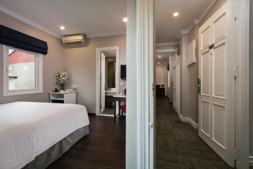 Postel nebo postele na pokoji v ubytování Flora Centre Hotel & Spa