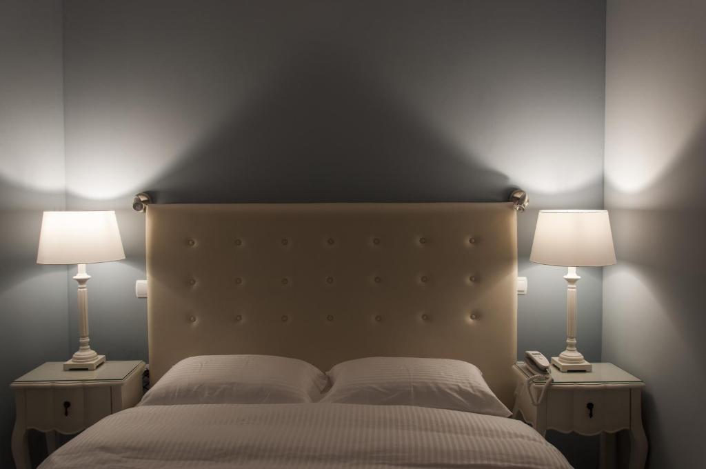 Postel nebo postele na pokoji v ubytování Hotel Marianna