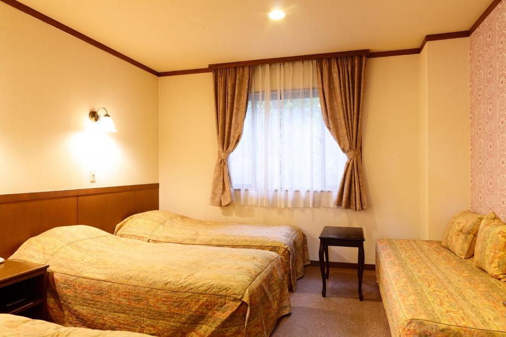 Postel nebo postele na pokoji v ubytování Heidihof Hotel