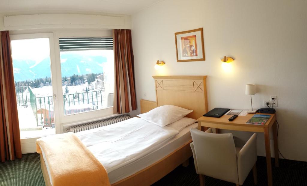 Postel nebo postele na pokoji v ubytování Hôtel Splendide