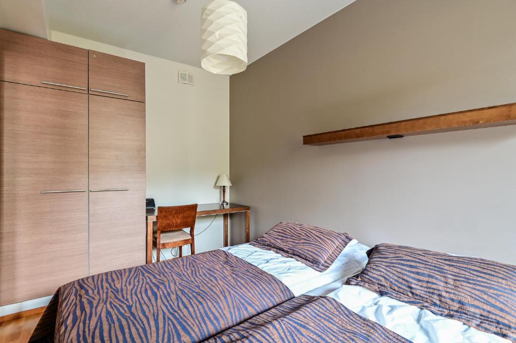 Postel nebo postele na pokoji v ubytování Ylläs Saaga Ski Chalets 2