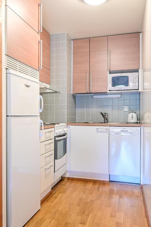 Kuchyň nebo kuchyňský kout v ubytování Ylläs Saaga Ski Chalets 2